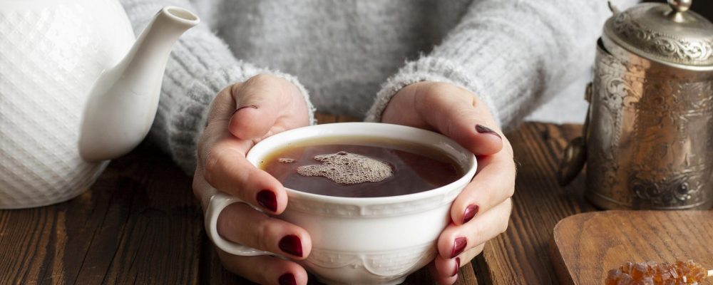 front-view-of-woman-with-tea-concept